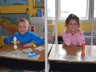 St Helen Admission Children Smiling Sitting at Desks